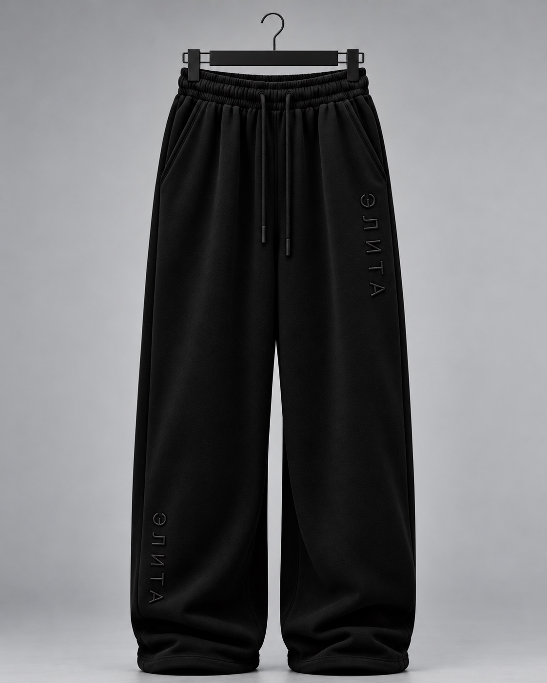 Black pants front with tonal leg embroidery